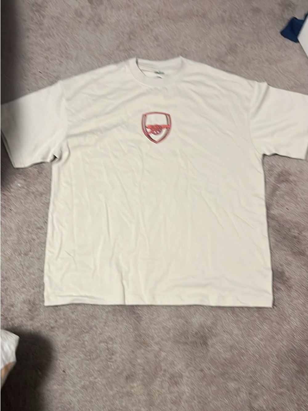 La Golazo Cream Short-Sleeve Tee with Red Shield Logo